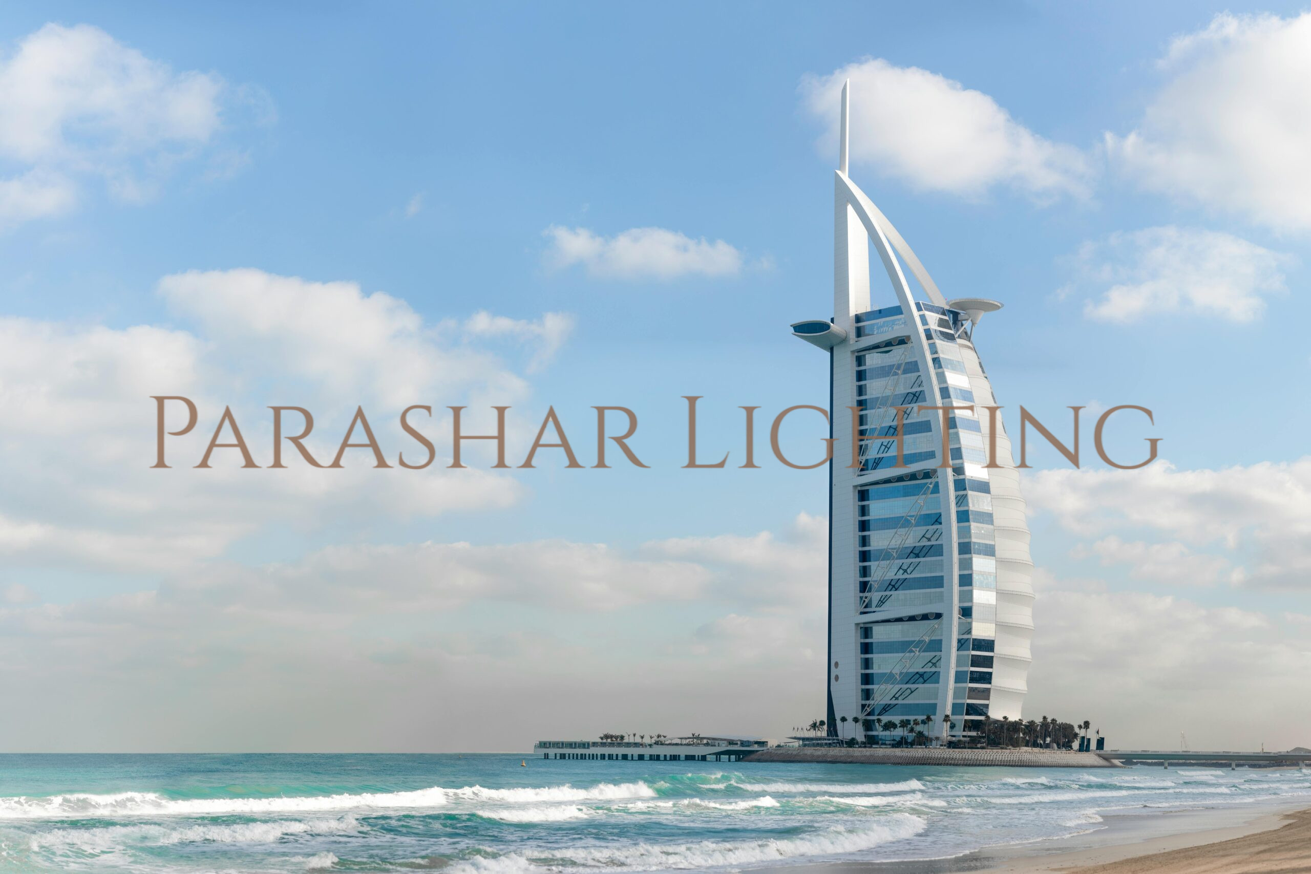 Stunning view of Burj Al Arab with a serene beach setting in Dubai, UAE.